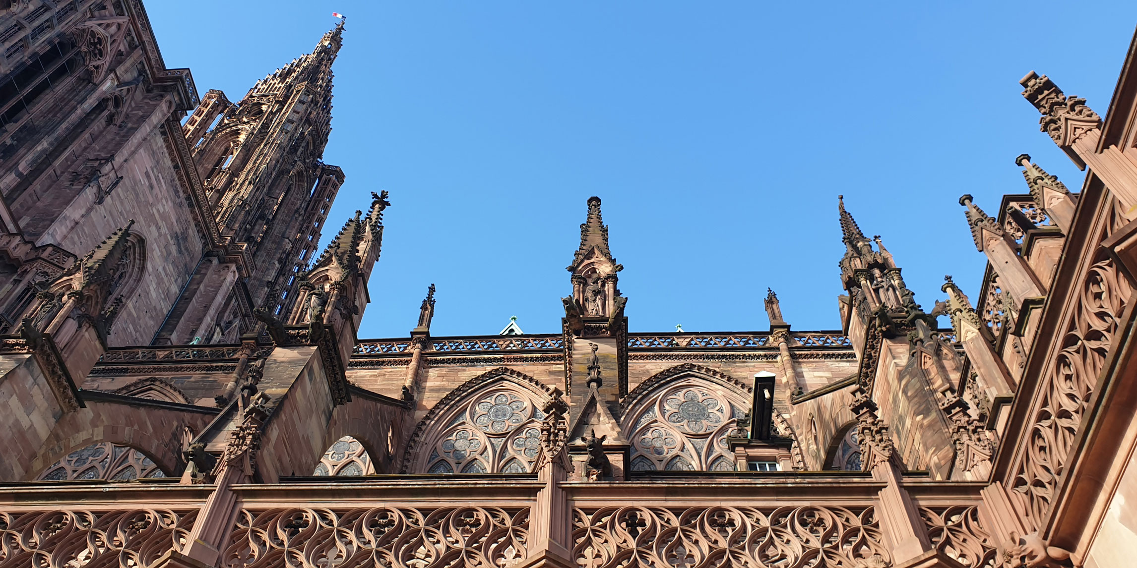 exterior view of Cathédrale Notre-Dame-de-Strasbourg against a blue sky