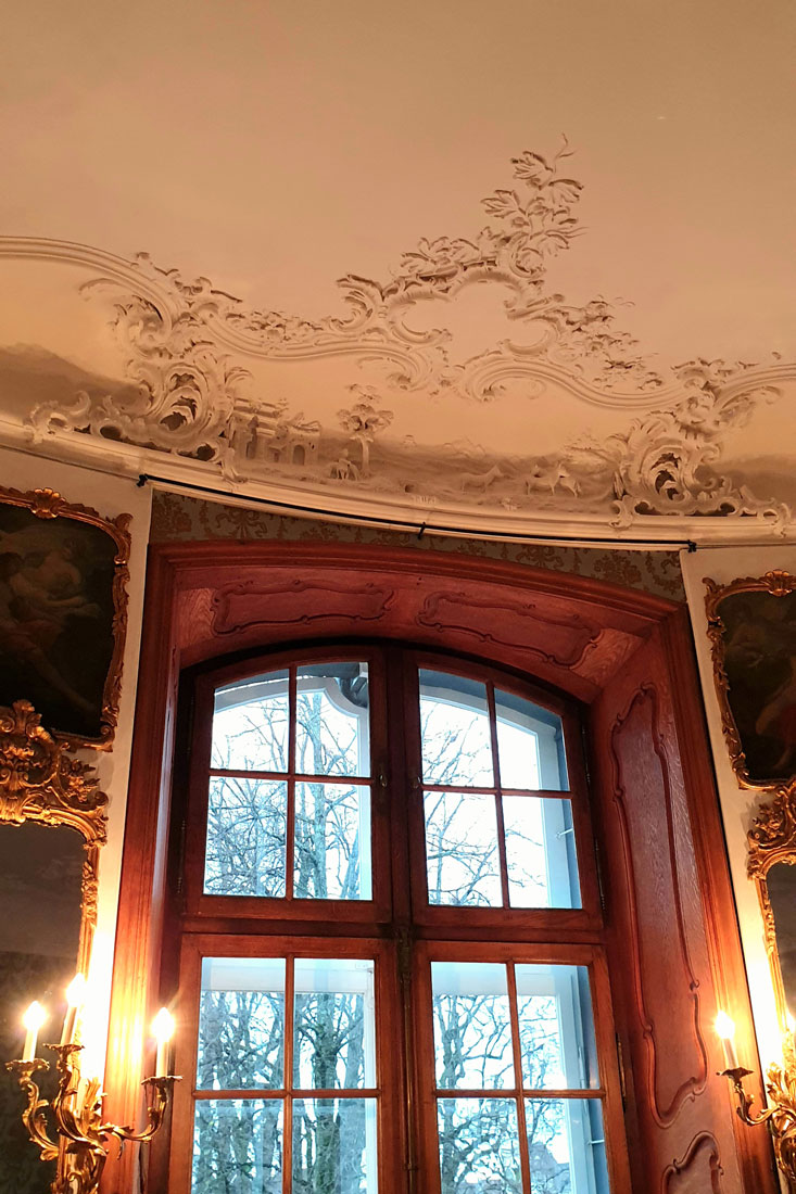 a window and a ceiling decoration of stucco in the rococo style in the Gobelin Room of the Wildt'sche Haus, Basel